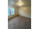 An empty bedroom featuring neutral walls, carpeted floors, and ample natural light at 5413 Bristol Bend Ct, Las Vegas, NV 89135