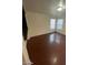 A well-lit bedroom with modern flooring and two windows for ample natural light at 5413 Bristol Bend Ct, Las Vegas, NV 89135