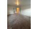 Spacious bedroom with wall-to-wall carpet and two doorways visible at 5413 Bristol Bend Ct, Las Vegas, NV 89135