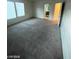 Large bedroom with neutral carpet, windows and a partially visible en suite at 5413 Bristol Bend Ct, Las Vegas, NV 89135