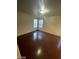 Cozy bedroom featuring wood floors and natural light from two windows at 5413 Bristol Bend Ct, Las Vegas, NV 89135
