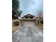 Home featuring a two-car garage, stone accents, and a covered porch at 5413 Bristol Bend Ct, Las Vegas, NV 89135