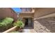 A home's front entrance with a stone accent wall and desert landscaping at 5413 Bristol Bend Ct, Las Vegas, NV 89135