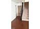 View of the entry hallway featuring carpeted stairs and wood flooring at 5413 Bristol Bend Ct, Las Vegas, NV 89135