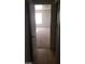 Hallway leading to a carpeted room with an open white door at 5413 Bristol Bend Ct, Las Vegas, NV 89135