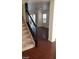 Entry hall with stairs to the upper level, wood floors, and natural light at 5413 Bristol Bend Ct, Las Vegas, NV 89135