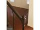 Hallway with dark wood railing looking down on hardwood floors at 5413 Bristol Bend Ct, Las Vegas, NV 89135