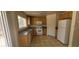 Bright kitchen featuring tile floors and granite countertops with a backyard view at 5413 Bristol Bend Ct, Las Vegas, NV 89135