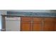 Kitchen sink with granite countertops and wood cabinets at 5413 Bristol Bend Ct, Las Vegas, NV 89135