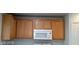Kitchen features wood cabinets with a built in microwave at 5413 Bristol Bend Ct, Las Vegas, NV 89135