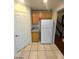 Kitchen features wood cabinets, granite counters, and white refrigerator at 5413 Bristol Bend Ct, Las Vegas, NV 89135