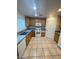 Kitchen featuring tile floors and granite countertops with stainless steel appliances at 5413 Bristol Bend Ct, Las Vegas, NV 89135