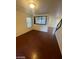 Inviting living room featuring wood floors, staircase, and open layout at 5413 Bristol Bend Ct, Las Vegas, NV 89135