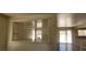 This living room has an open concept, hard wood floors, and access to the back yard at 5413 Bristol Bend Ct, Las Vegas, NV 89135