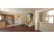 Open-concept living space featuring stairs, kitchen, and breakfast bar for seamless living at 5413 Bristol Bend Ct, Las Vegas, NV 89135
