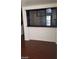 Living area with wood floors and a decorative pass through to the kitchen at 5413 Bristol Bend Ct, Las Vegas, NV 89135