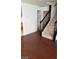 Staircase with wood railing leading to the upper level at 5413 Bristol Bend Ct, Las Vegas, NV 89135