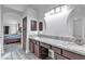 Long bathroom with double sinks, granite countertop, and linen storage at 5841 Doubletree Rd, Pahrump, NV 89061