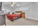 Carpeted bedroom with a ceiling fan, lots of light, and side tables at 5841 Doubletree Rd, Pahrump, NV 89061