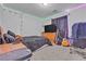 This bedroom features a comfy black bed, carpet flooring, and colorful LED lights lining the ceiling at 5841 Doubletree Rd, Pahrump, NV 89061