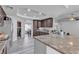 Spacious kitchen with granite countertops and ample storage, seamlessly connecting to the dining and living areas at 5841 Doubletree Rd, Pahrump, NV 89061