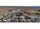 Vast aerial view showcasing the surrounding landscape and layout of a rural community with open land at 5841 Doubletree Rd, Pahrump, NV 89061