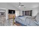 Spacious main bedroom with a large TV, a fireplace in the adjacent living area, and access to the backyard at 5841 Doubletree Rd, Pahrump, NV 89061