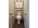 Bathroom with white toilet, above storage, and grab bars at 6028 Turtle River Ave, Las Vegas, NV 89156