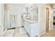 Bright bathroom featuring granite counters, a glass shower, and white cabinetry at 6145 Scarlet Leaf St, Las Vegas, NV 89148