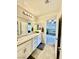 A bathroom featuring dual sinks, granite counters, and white cabinetry at 6145 Scarlet Leaf St, Las Vegas, NV 89148