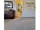 A bedroom with neutral carpet and an 