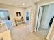 Bright hallway with neutral colors, carpet, and access to multiple rooms at 6145 Scarlet Leaf St, Las Vegas, NV 89148