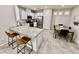 Modern kitchen with granite countertops, stainless steel appliances, and a breakfast bar at 6145 Scarlet Leaf St, Las Vegas, NV 89148