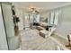 Bright living room boasting modern furnishings, tiled floors, and a ceiling fan at 6145 Scarlet Leaf St, Las Vegas, NV 89148
