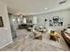 Spacious living room with tiled flooring, plush seating, and lots of natural light at 6145 Scarlet Leaf St, Las Vegas, NV 89148