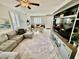 Open-concept living room featuring comfortable seating, tiled flooring and natural light at 6145 Scarlet Leaf St, Las Vegas, NV 89148