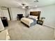 Spacious main bedroom featuring a ceiling fan, wood headboard, and neutral tones at 6145 Scarlet Leaf St, Las Vegas, NV 89148
