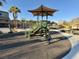 Community playground with various play structures and a soft surface for to enjoy at 6145 Scarlet Leaf St, Las Vegas, NV 89148