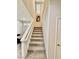 Carpeted staircase leading to the upper level with adjacent dining area at 6145 Scarlet Leaf St, Las Vegas, NV 89148