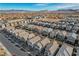 Beautiful aerial shot of a residential community with well-maintained homes and green spaces under a clear blue sky at 6221 Desert Orchid Way, Las Vegas, NV 89141