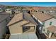 An aerial view of this home in the neighborhood, focusing on the balcony and patio cover at 6221 Desert Orchid Way, Las Vegas, NV 89141