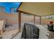 A covered patio with brick pavers, a blank slate for the next homeowner to complete at 6221 Desert Orchid Way, Las Vegas, NV 89141
