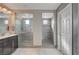 Modern bathroom boasts dual shower spaces, stylish vanity, and elegant tile work at 6221 Desert Orchid Way, Las Vegas, NV 89141