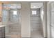 Luxury bathroom with dual shower, rain shower heads, and modern gray tile design at 6221 Desert Orchid Way, Las Vegas, NV 89141