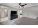 Well-lit bedroom offers ensuite access, plush carpet, and contemporary design elements at 6221 Desert Orchid Way, Las Vegas, NV 89141