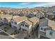 Attractive two-story home featuring a tiled roof, an attached garage, and a beautifully landscaped front yard at 6221 Desert Orchid Way, Las Vegas, NV 89141