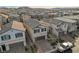 Inviting two-story home with a paved driveway, attached garage, and meticulous landscaping in a vibrant community at 6221 Desert Orchid Way, Las Vegas, NV 89141