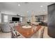 Inviting living room with an open layout, flowing into the kitchen and dining areas, perfect for entertaining at 6221 Desert Orchid Way, Las Vegas, NV 89141