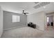 Inviting loft area showcases soft carpet, a sleek ceiling fan, and neutral décor, ideal for relaxation at 6221 Desert Orchid Way, Las Vegas, NV 89141