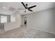 Spacious loft area features plush carpet, modern ceiling fan, and neutral paint, perfect for flexible living at 6221 Desert Orchid Way, Las Vegas, NV 89141